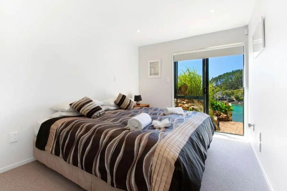 Bedroom opening to the garden and bay