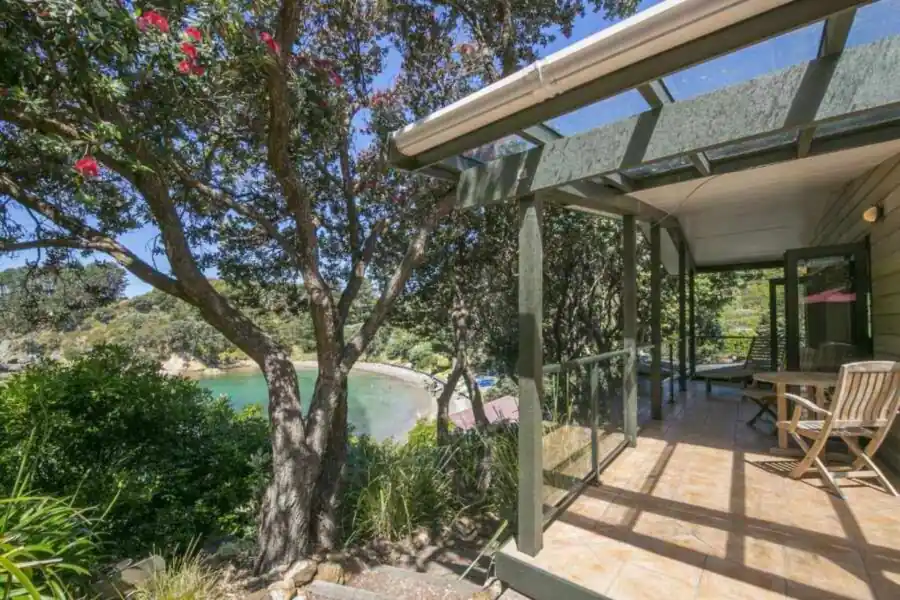 Covered deck at Beachfront Enclosure Bay overlooking the bay